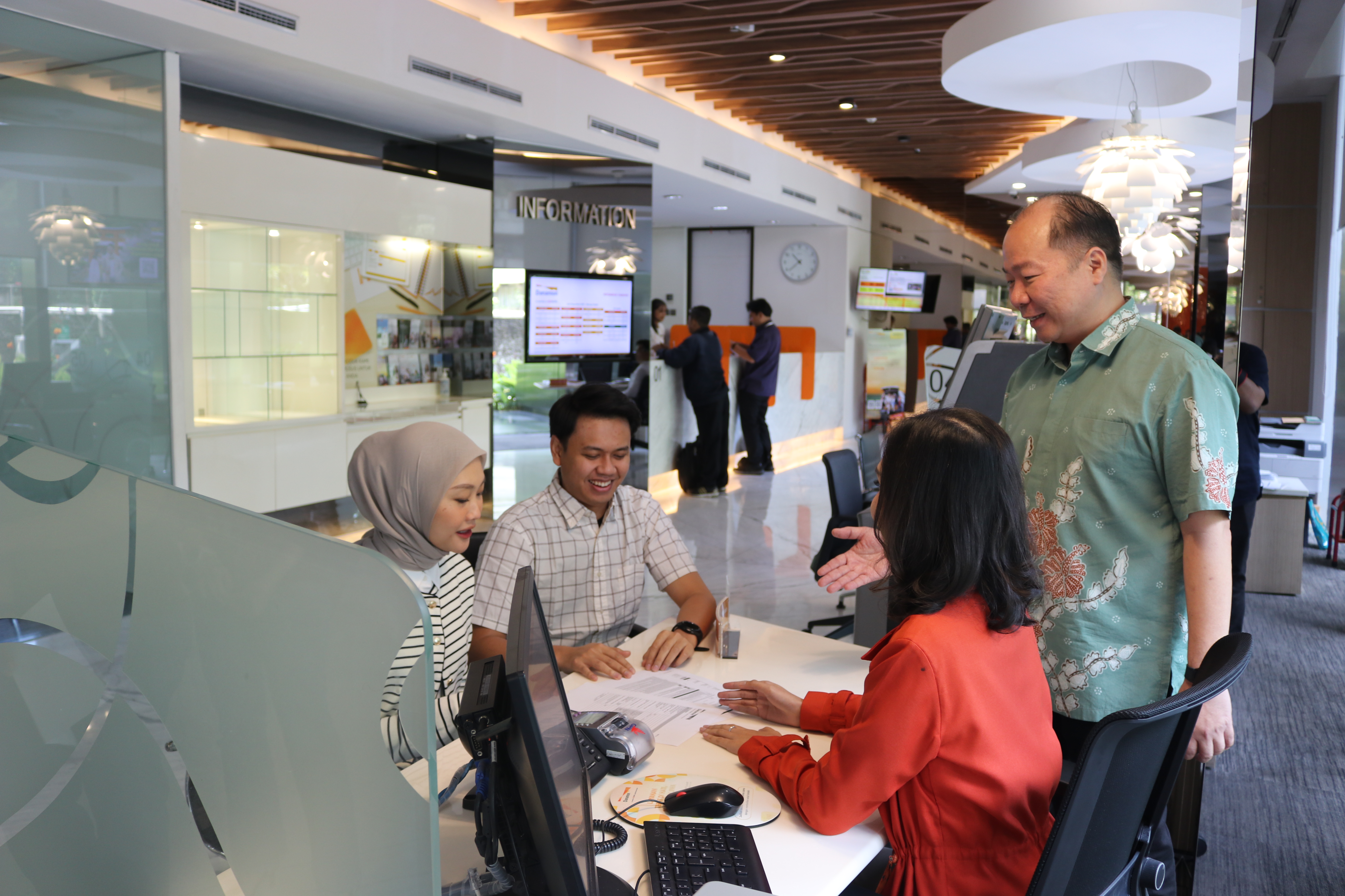 Eka Dinata, Branch Network Head, PT Bank Danamon Indonesia Tbk (Right) Visited Menara Bank Danamon  Branch Office and Greets Customers Directly during Branch Office Operating Hours